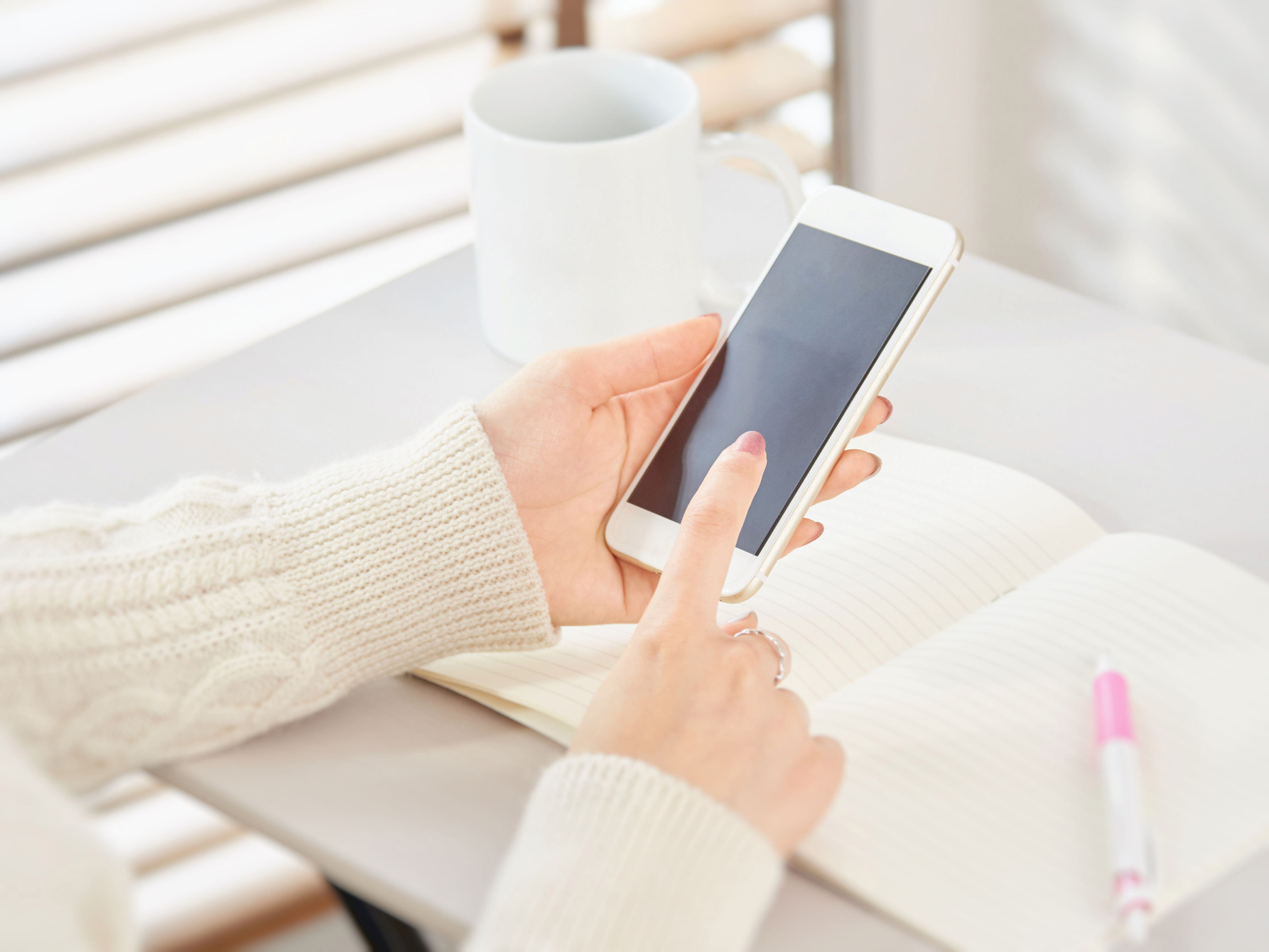 Woman operating a smartphone